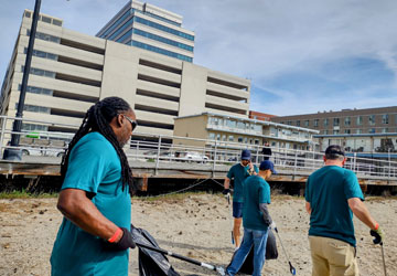 volunteers cleaning up the beach